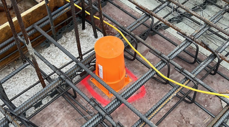 The orange QuelCast product placed in position, ready to be installed.