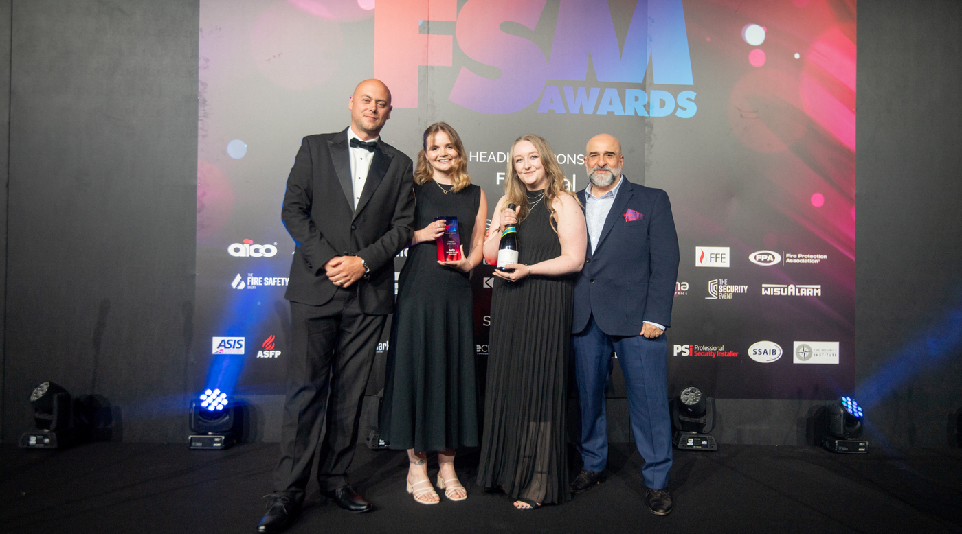 Hayley Clay and Rebecca Croton, from the marketing team, on stage receiving the Campaign of the Year 2025 Award at the FSM Awards.