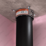 A Quelfire fire collar installed around a plastic pipe, penetrating a concrete fire compartment floor. 