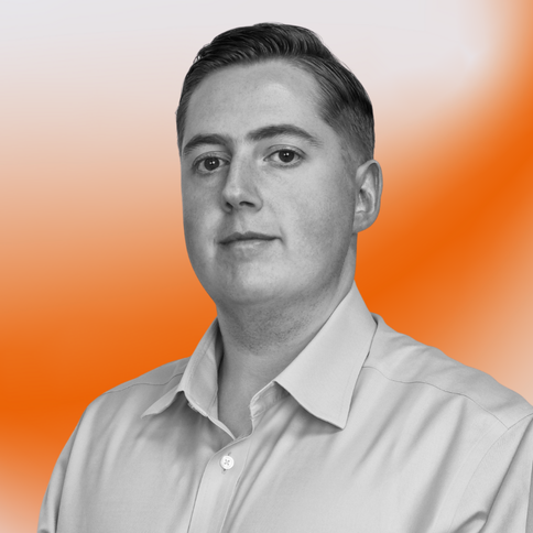 Glenn Hutchins, Technical, with a black-and-white filter. The background is an orange gradient. 