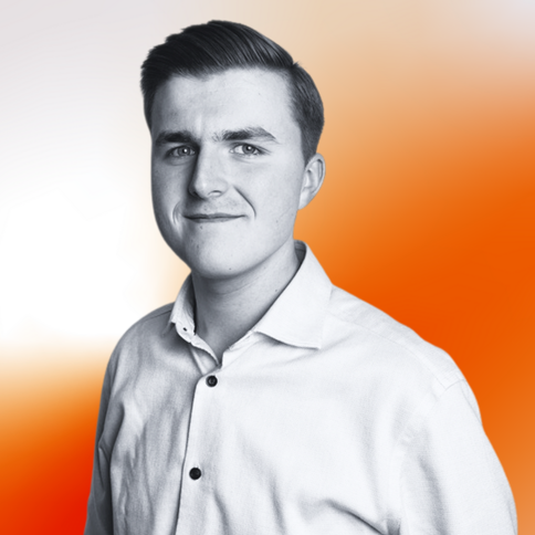 Josh Hutchins, Internal Sales Account Manager, with a black-and-white filter. He is a wearing a long-sleeved shirt. The background is an orange gradient. 