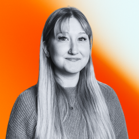 Black-and-white image of Lottie Payne, Junior Content Producer, on an orange-gradient background. 