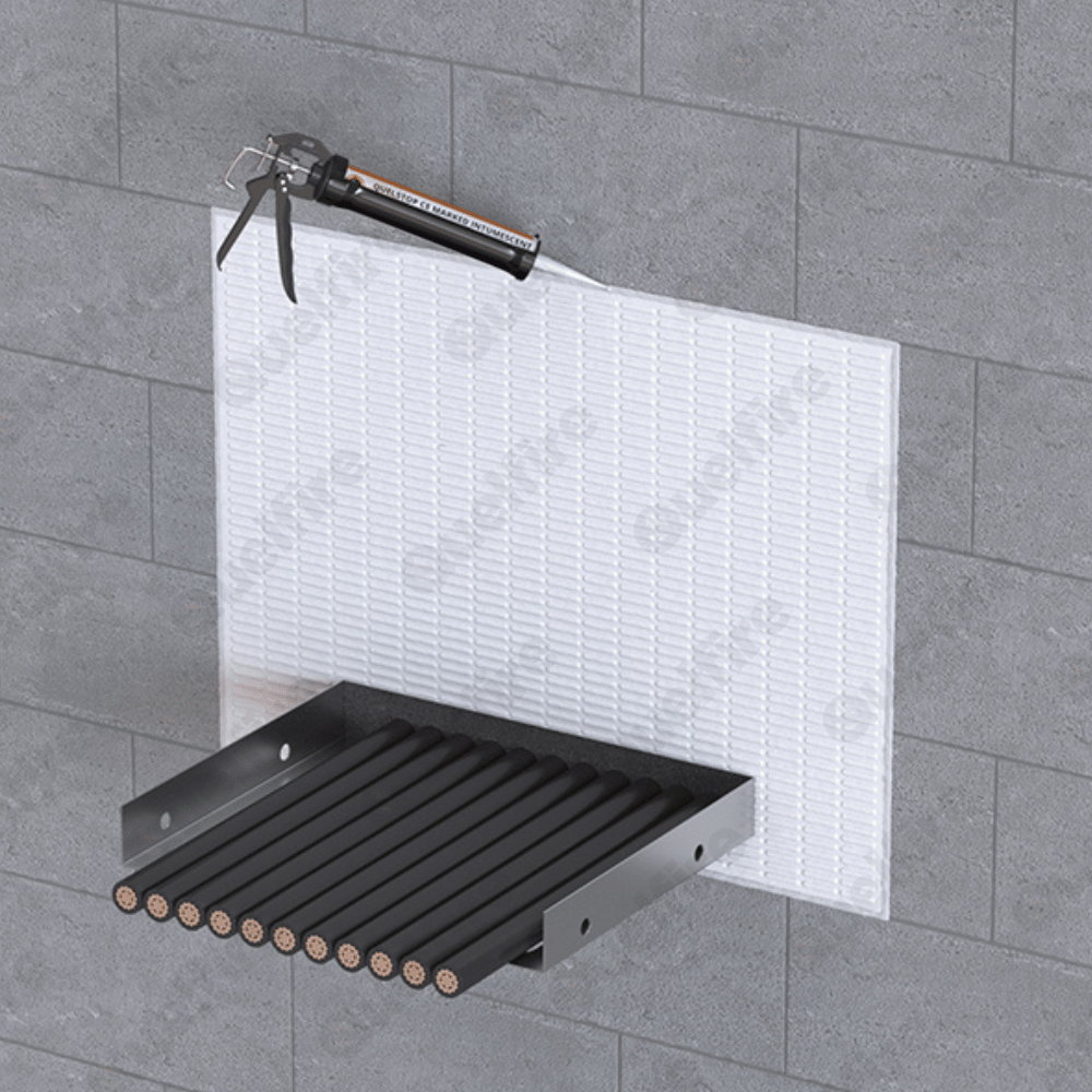 HPE Sealant around a cable tray in fire batt with a sealant gun applying acrylic sealant around the outside, in a fire compartment wall.
