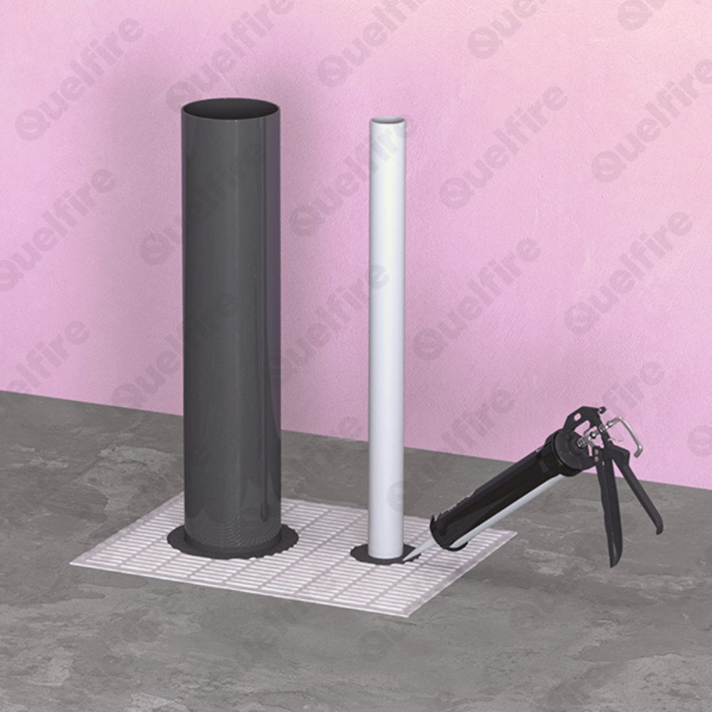Quelfire HPE Sealant around plastic pipes in Fire Batt in a fire compartment floor. There's a black sealant gun applying sealant around the pipe.