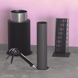 Quelfire HPE Sealant around a cable tray, insulated non-combustible and plastic pipes penetrating a fire compartment floor. There is a sealant gun applying sealant around the plastic pipes. 