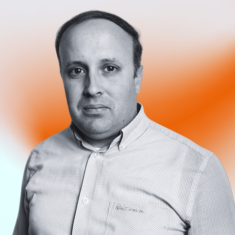 Roy Burt, Technical Sales, with a black-and-white filter. The background is an orange gradient. 