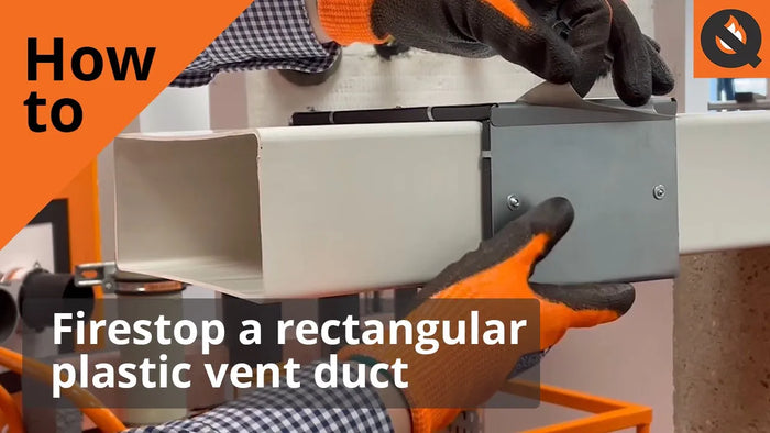 A person demonstrating how to install a fire sleeve. They are wearing orange gloves and a navy check shirt. The image is titled, 'How to firestop a rectangular plastic vent duct'. 