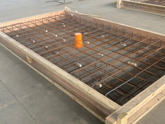 Quelfire's QuelCast Cast in Fire Collar installed into a demo construction. 